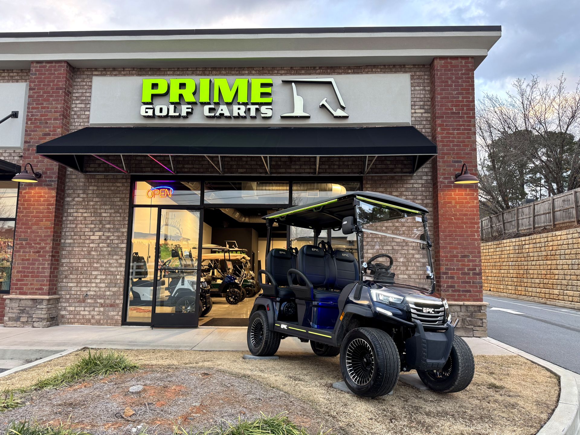 The Prime Golf Carts of Woodstock showroom on Highway 92, with a black EPIC lifted golf cart parked out front
